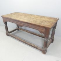 A 19th century two-plank serving table, with carved decoration and raised on turned legs with all-