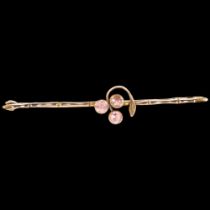 An Antique unmarked gold and amethyst set bar brooch