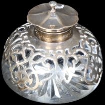 An Edward VII glass and ornate silver-mounted inkwell, with hinged lids, hallmarks for London 1907