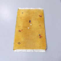 A yellow-ground Indo-Gabbeh mat. 89x59cm.