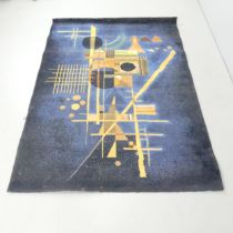 A modern blue-ground machine made rug. 190x133cm.