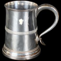 A 19th century silver plate on copper 2 pint tankard, with stylised scroll handle and flared rim