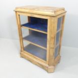 A Victorian walnut pier display cabinet, with single glazed panelled door, glazed sides and brass