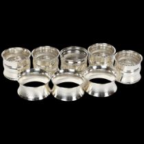 8 silver napkin rings, to include a set of 4, a set of 3, and 1 other, 5oz