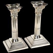 A pair of Elizabeth II silver Corinthian column candlesticks on stepped plinth base, H19cm,