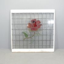 A leadlight glazed window with rose design. 114x113cm.