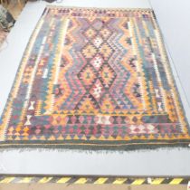 A large Kilim carpet. 288x196cm.