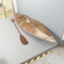 A Percy Blandford design skin-on frame kayak with paddle. 340cm