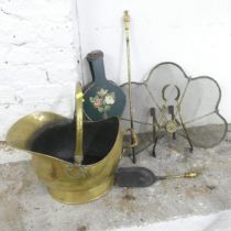 A brass fire screen, a pair of bellows, a coal scuttle and companion set.