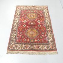 A red-ground Qashqai rug. 160x110cm