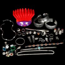 A collection of various silver jewellery, including a child's christening bangle, various rings,