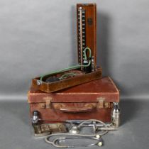 A vintage Doctors medical bag, containing various vintage medical instruments including a