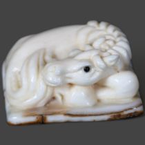 Carving / Curiosity - A carved fossilised Mammoth tusk Netsuke of a horse