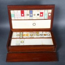 A Victorian microscope slide collectors cabinet, seven drawers, containing a collection of slides