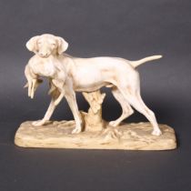 A Royal Dux porcelain sculpture of a hunting dog with a hare in its mouth on a naturalistic base,