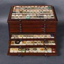 A Victorian microscope slide collectors chest, of eight drawers, stained wood, containing an