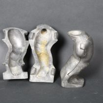 A pair of vintage aluminium moulds for dolls legs, height 18.5cm, both mould are marked to the