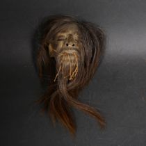 A Shrunken Head (Tsam tsa) sculpture, originally used for trading and human rituals, height 10cm