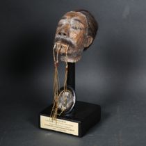 Curiosity / Macabre - A modern Shrunken Head sculpture, label reading "Alleged to be the last