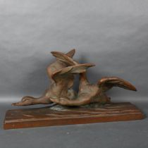 A large patinated bronzed terracotta study of flying geese, signed R Pollin, L72cm