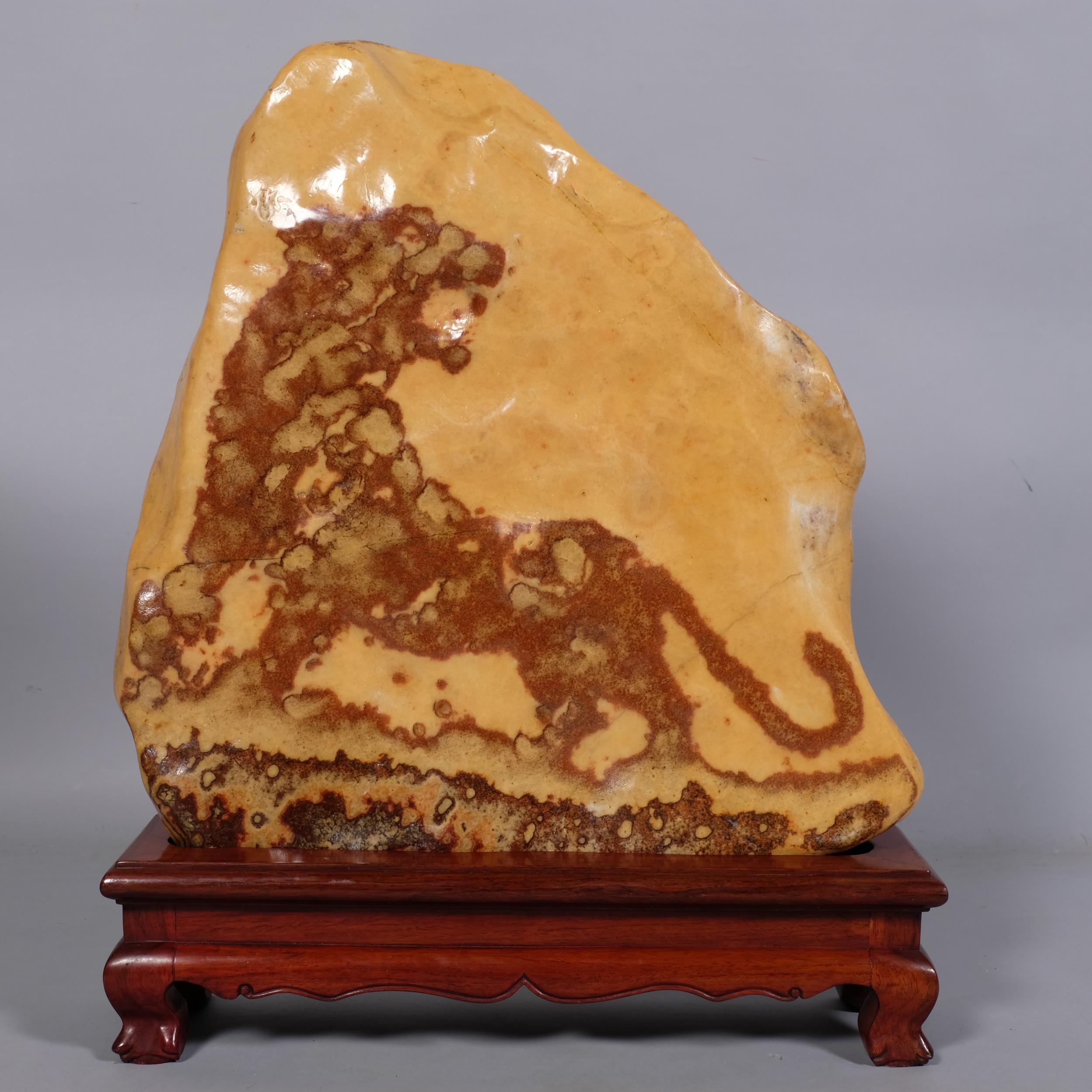 Abstract marble/stone sculpture depicting a tiger, on hardwood stand, overall height 55cm