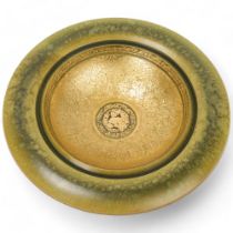 DENNIS HALES, a hand turned hardwood wall- hanging bowl, green coloured surface finish and gilding