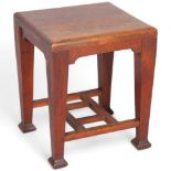 A mahogany Arts and Crafts side table, height 45cm, top 35 x 38cm Some historic woodworm in top,