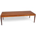 ARNE HOUMAND-OLSEN for Morgens-Kold, Denmark, a 1960s rosewood coffee table, makers label under top,