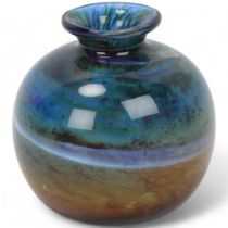 A small blue/green Isle of Wight glass vase, with flame pontil and lable to base, height 10cm Good