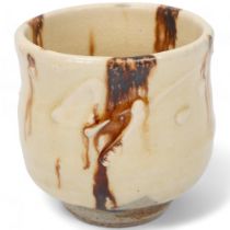 TAKESHI YASUDA (b.1943), a stoneware yunomi with nisai glaze with slip decoration, makers stamp to