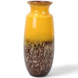 A vintage West German fat lava floor vase by Scheurich, with smooth yellow glaze to top half,