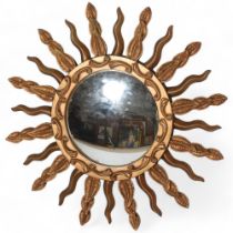 A mid 20th century convex sunburst mirror, signed to rim STALUC, diameter 57cm Good condition