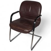 An mid 20th century cantilever office chair, heavy tubular steel frame with padded leather