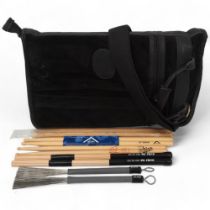 A Black Suede LEVY'S (Canada) STICKBAG contains: Two VIC FIRTH 'RUTE 606', Two PRO-MARK 'TB-5'