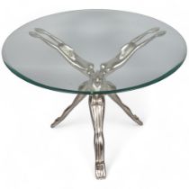 A cast aluminium and glass coffee table, the base with conjoined outstretched nudes, height 54cm,