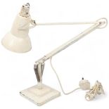 A Herbert Terry Anglepoise lamp, cream paintwork, with two-step base, makers stamp, approx height