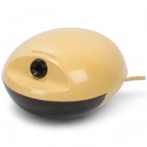 A 1960s' Boston egg electric pencil sharpener with cream and brown plastic body, model #16, makers