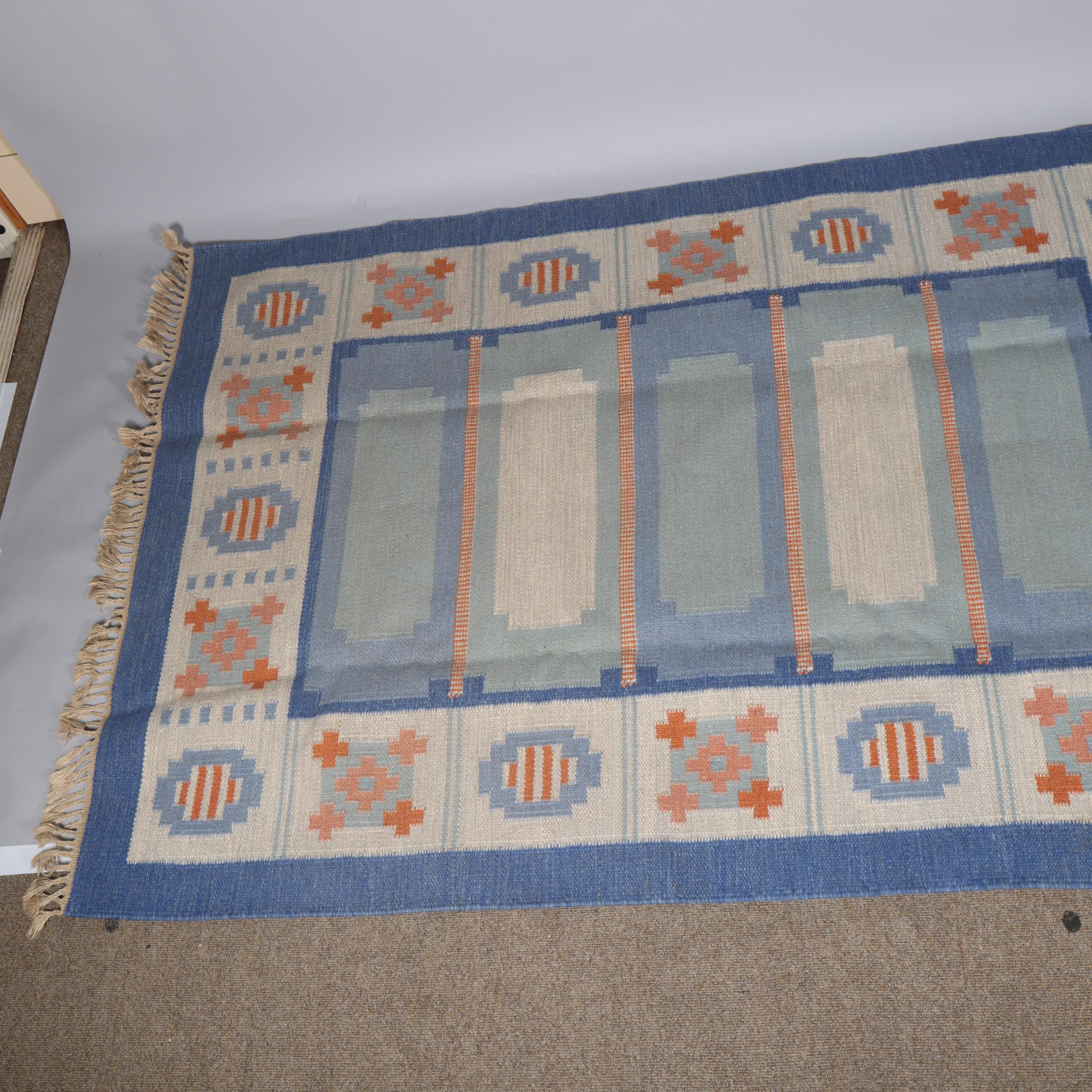 A Swedish flatweave rug, with a geometric pattern in shades of blue and dark pink, 205 X 140cms - Image 2 of 3