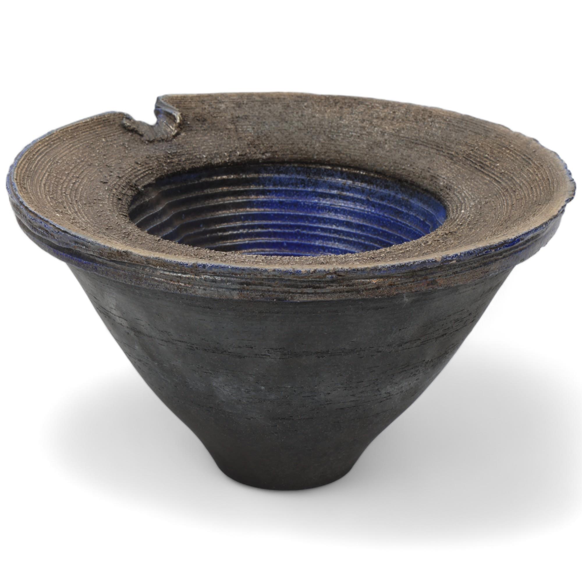 DAVID HOWARD JONES (b.1953), a thrown and altered raku vessel, blue metallic glaze to interior and