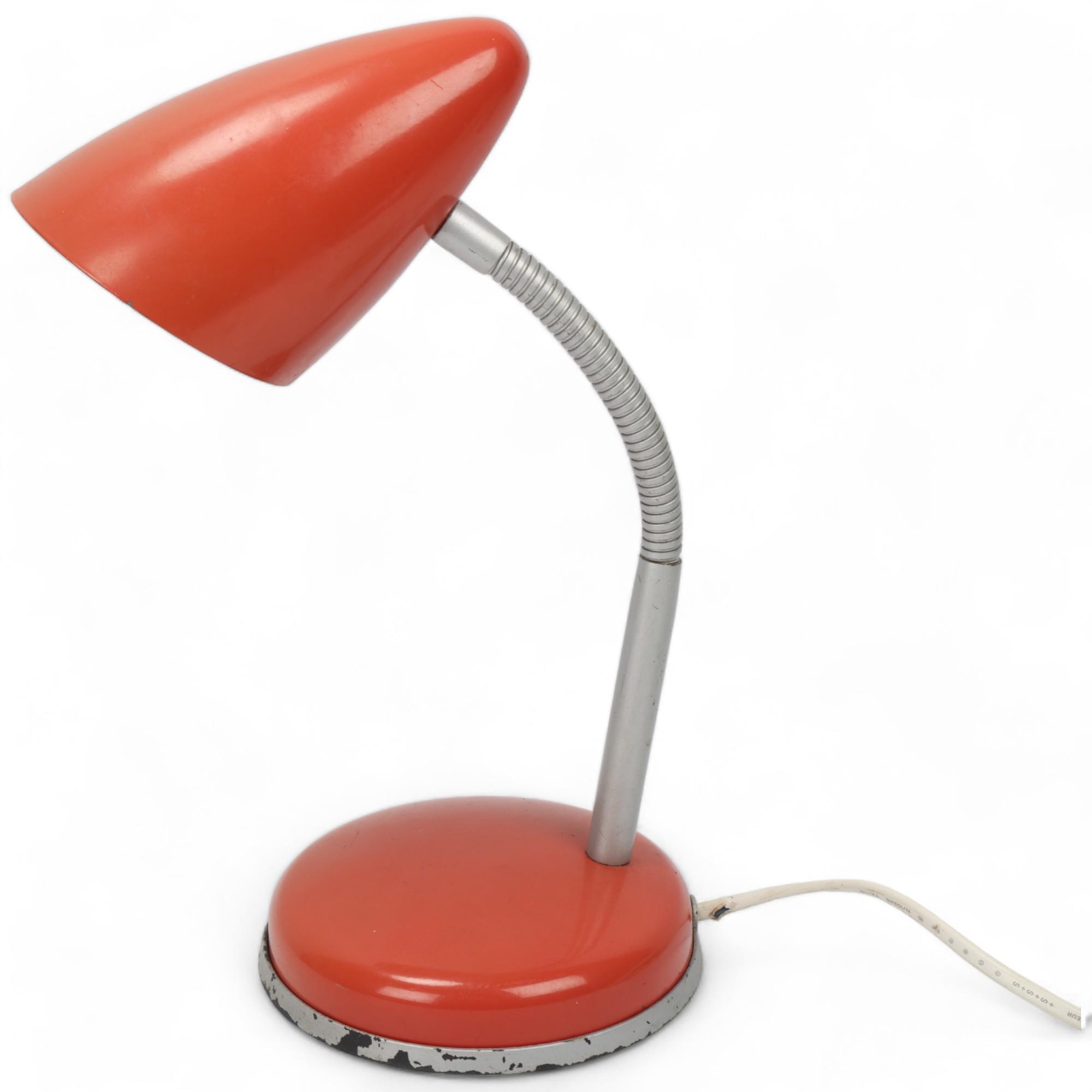 A mid 20th century table light, red steel shade and base with adjustable swan neck, manufacturers
