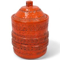 An Italian Bitossi style storage jar and cover, with orange glaze, makers mark to base, height