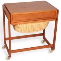 A Mid 20th Century teak sewing trolley/sewing table, with fitted drawer and rattan basket under top,