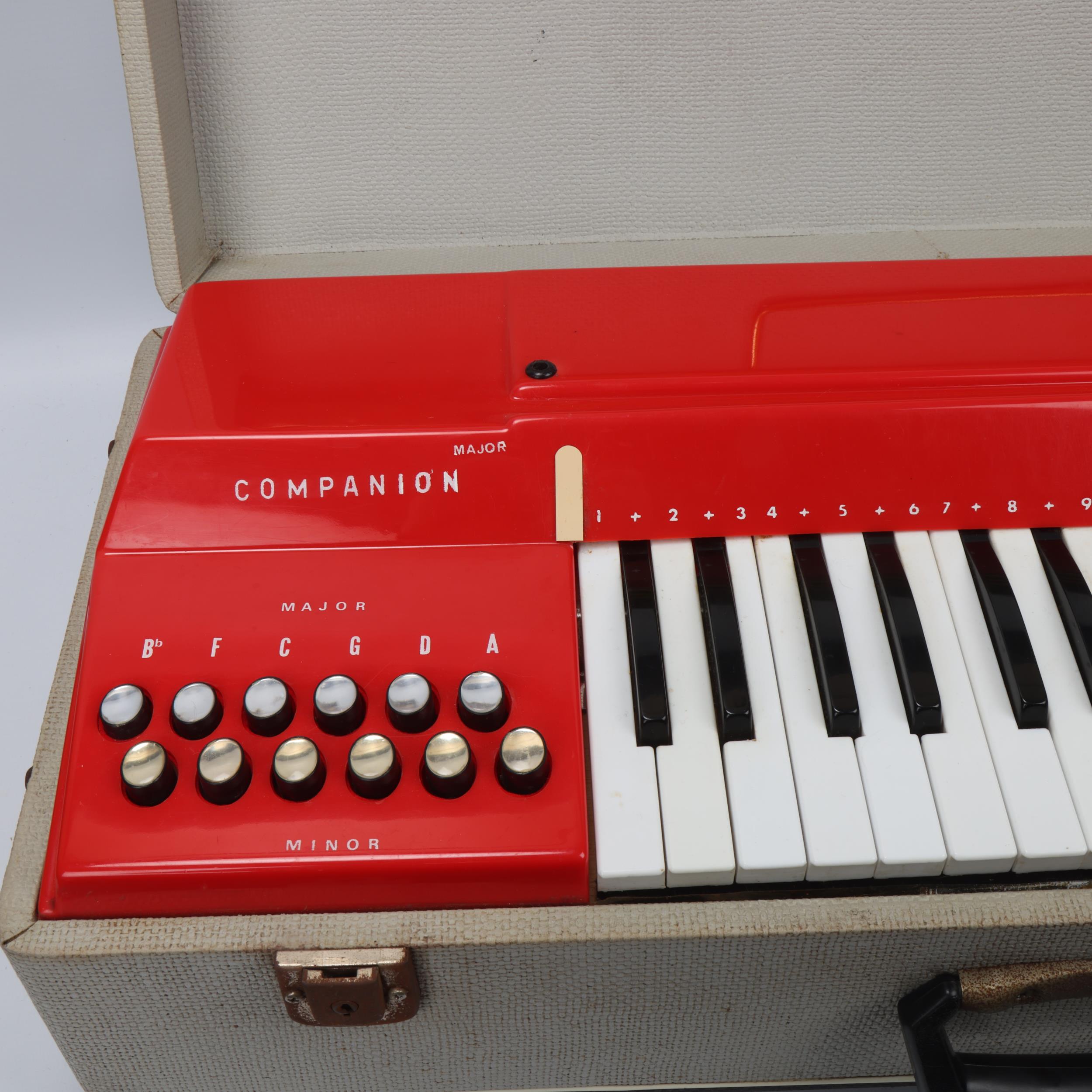 A mid 20th century Italian Companion electric keyboard, red plastic in original fixed carry case and - Image 2 of 3