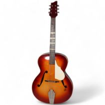 A 1957 Framus Archtop acoustic guitar, with sunburst finish, and original hard case Good playable