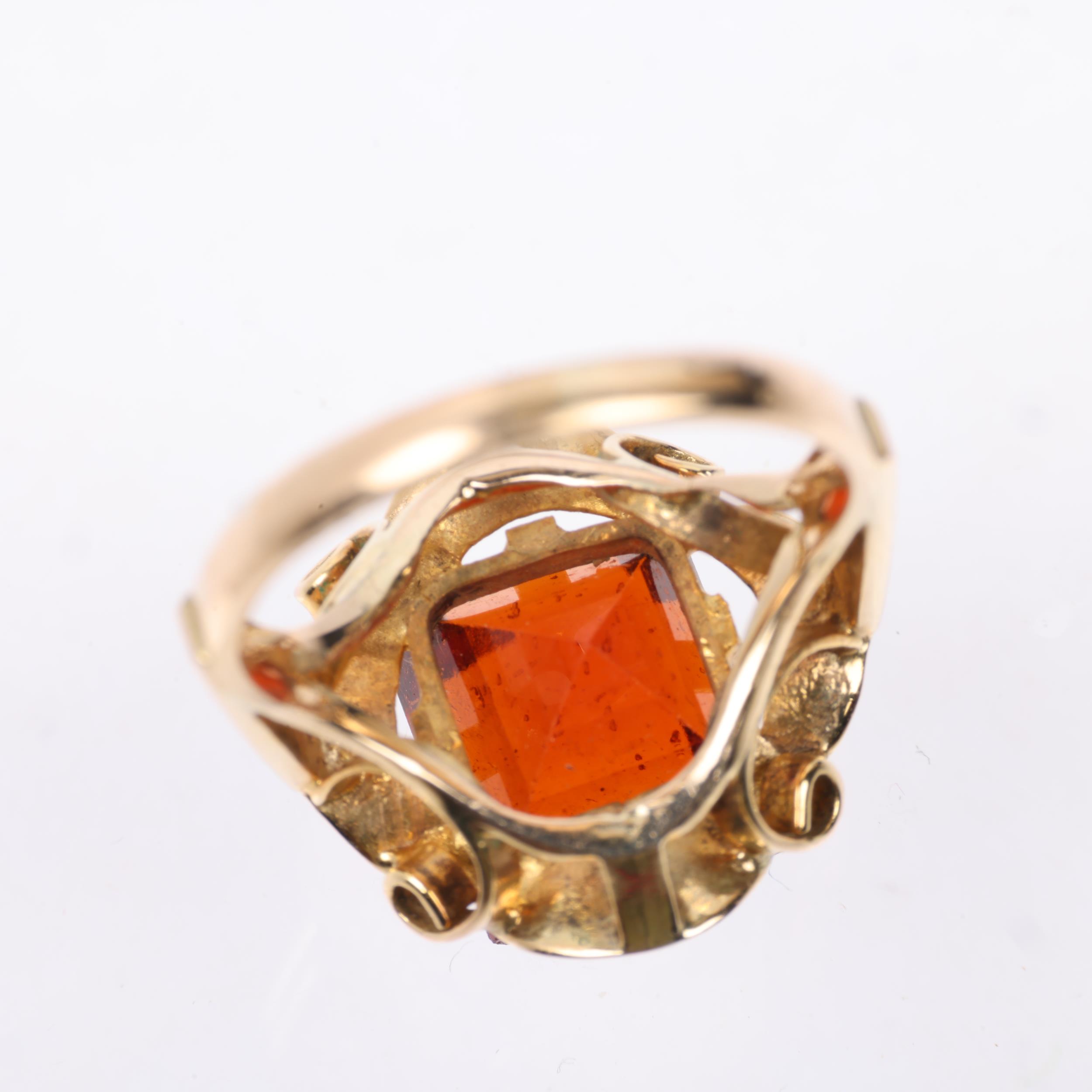 A late 20th century hessonite garnet dress ring, claw set with 9ct rectangular step-cut garnet, - Image 3 of 4