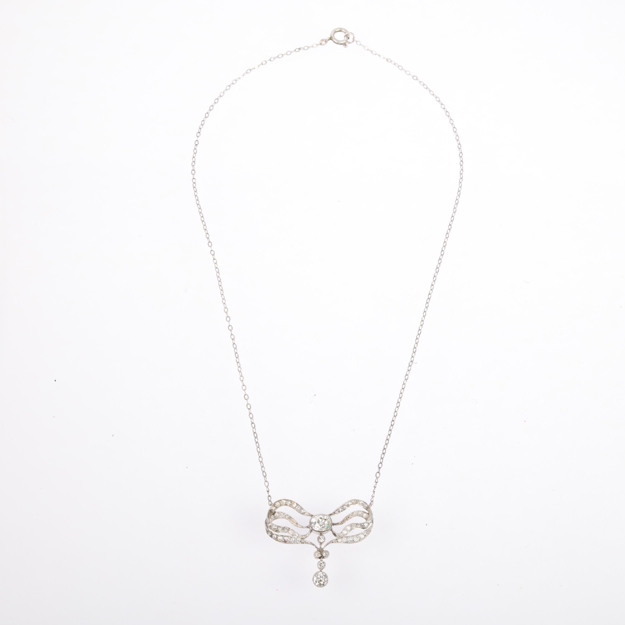 An Art Nouveau French diamond ribbon bow pendant necklace, circa 1910, set with old and eight-cut - Image 2 of 4