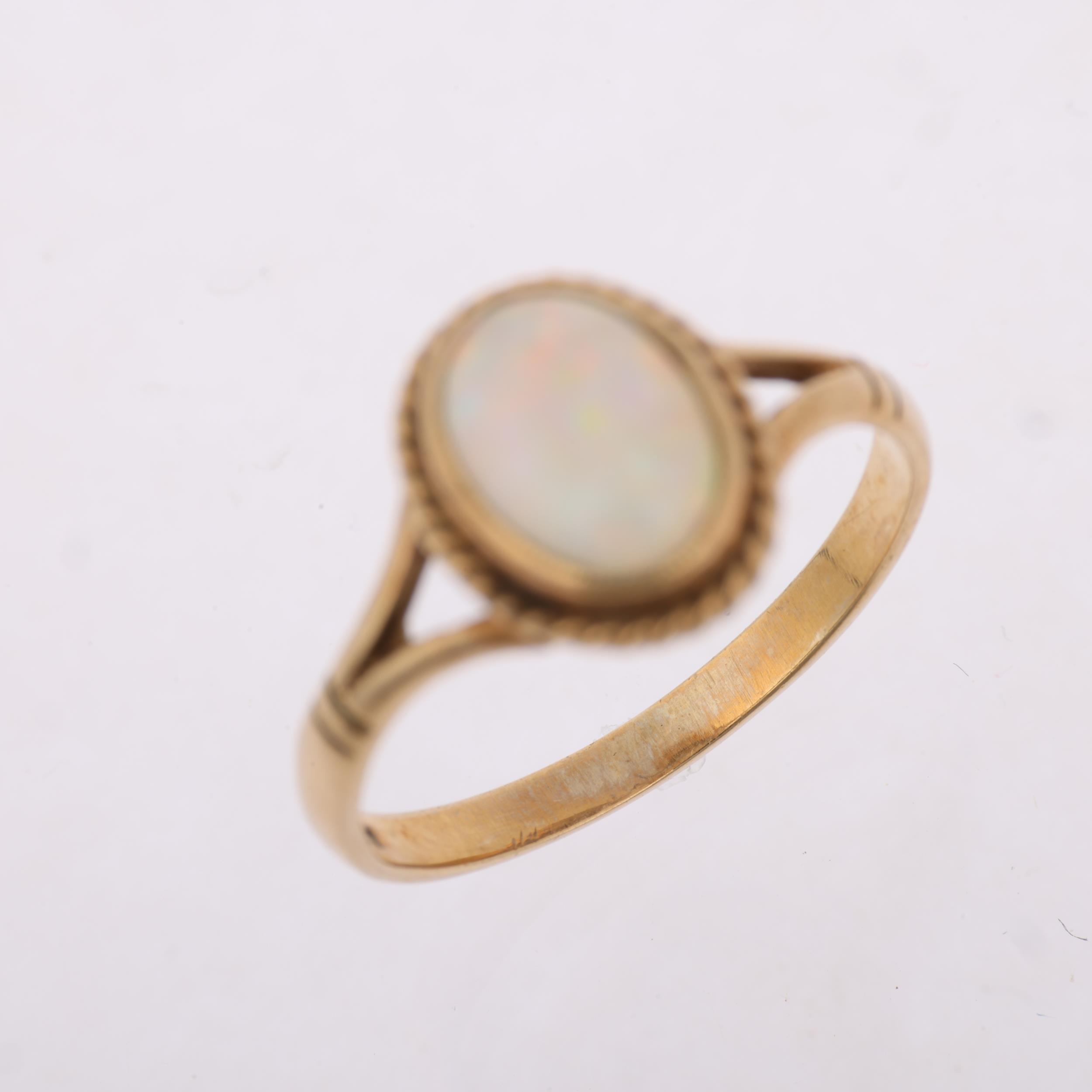 A late 20th century 9ct gold opal dress ring, maker S&S, Birmingham 1995, rub-over set with oval - Image 3 of 4