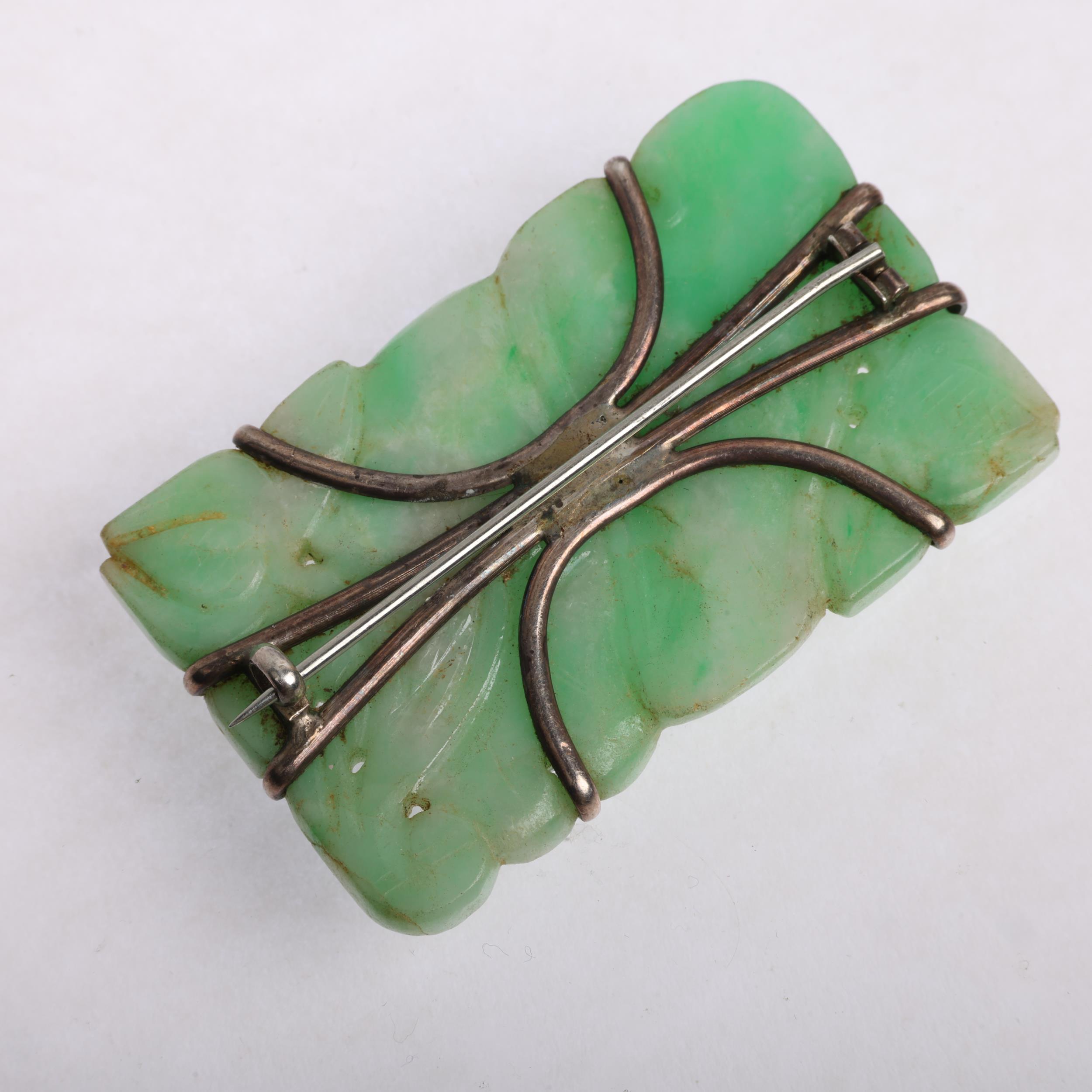 An early 20th century carved and polished jade floral panel brooch, apparently unmarked, 60.1mm, - Image 3 of 3