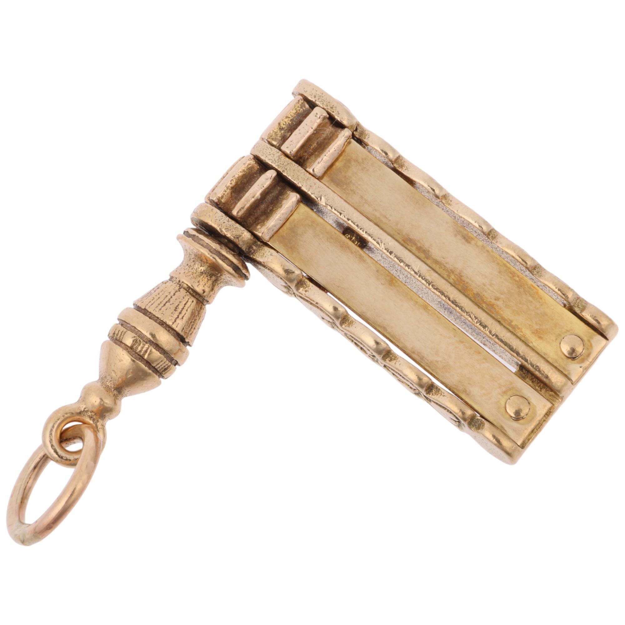 A late 20th century 9ct gold novelty World Cup football rattle clacker charm/pendant, maker GJ