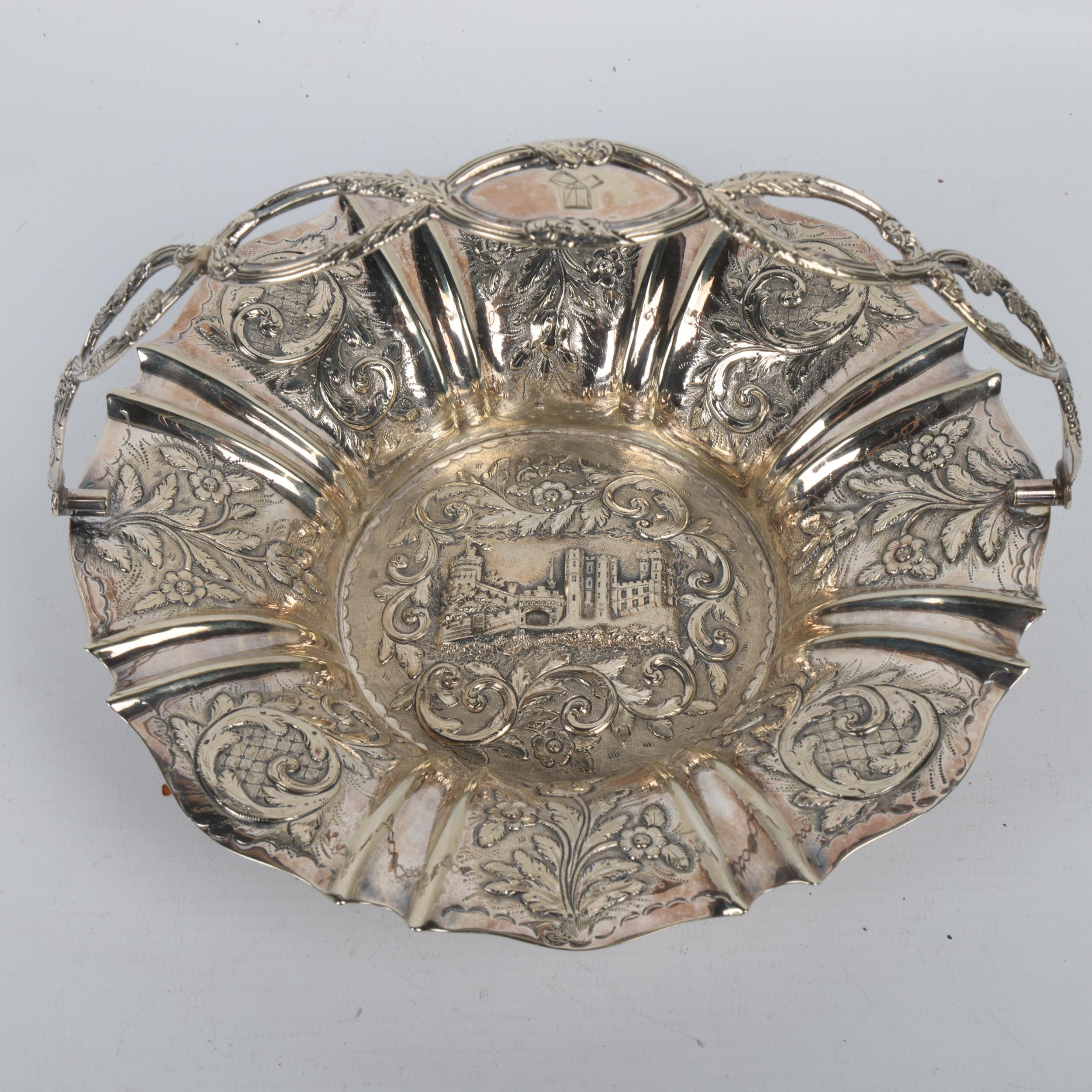 A Victorian unmarked silver 'Castle Top' swing handled cake basket, no maker, circa 1840, relief - Image 2 of 3